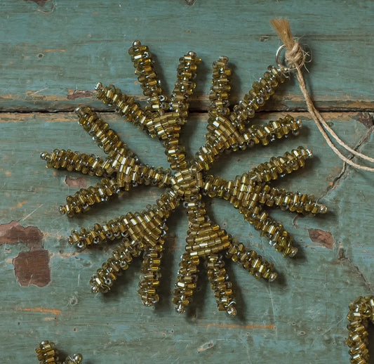 Gold beaded antique style snowflake decoration.